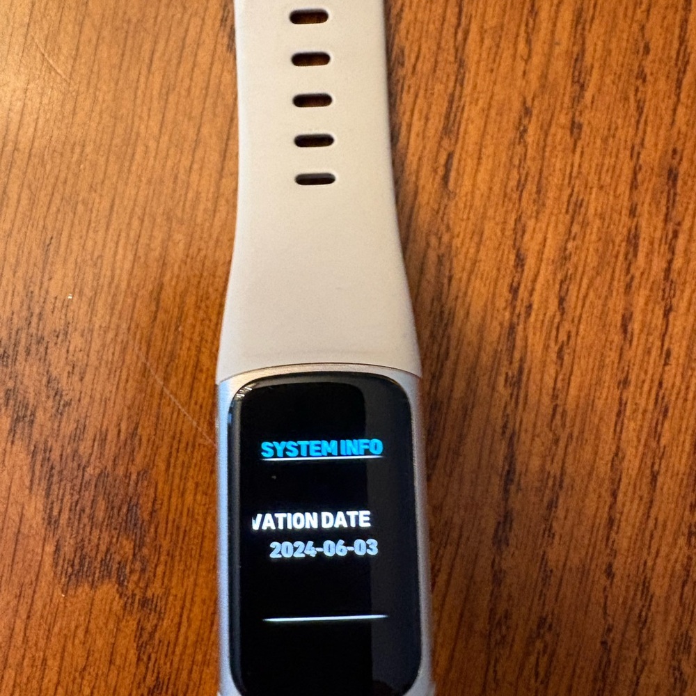Fitness tracker Smartwatch with Cream, Red, and Purple Bands - Picture 2 of 3